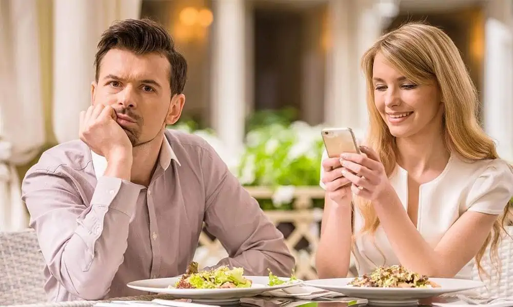 Date Going Wrong - Woman Checking Her Phone