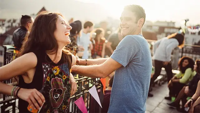 Man and Woman Flirting and Laughing