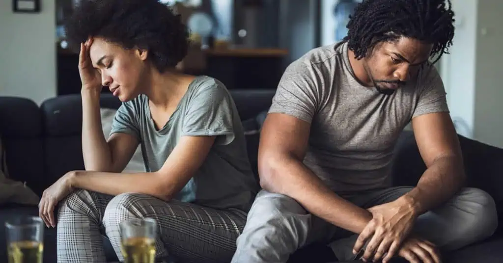 Troubled Couple - Couple Sitting on the Sofa After a Fight