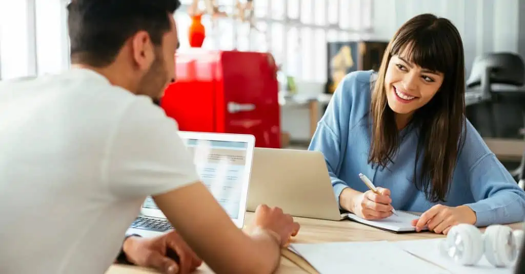 Coworkers Smiling at Each Other