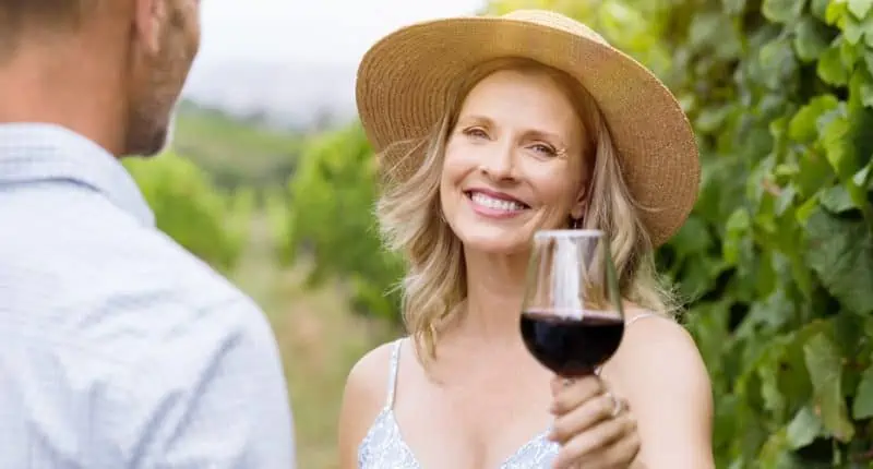 Mature Woman Raising Wine Glass