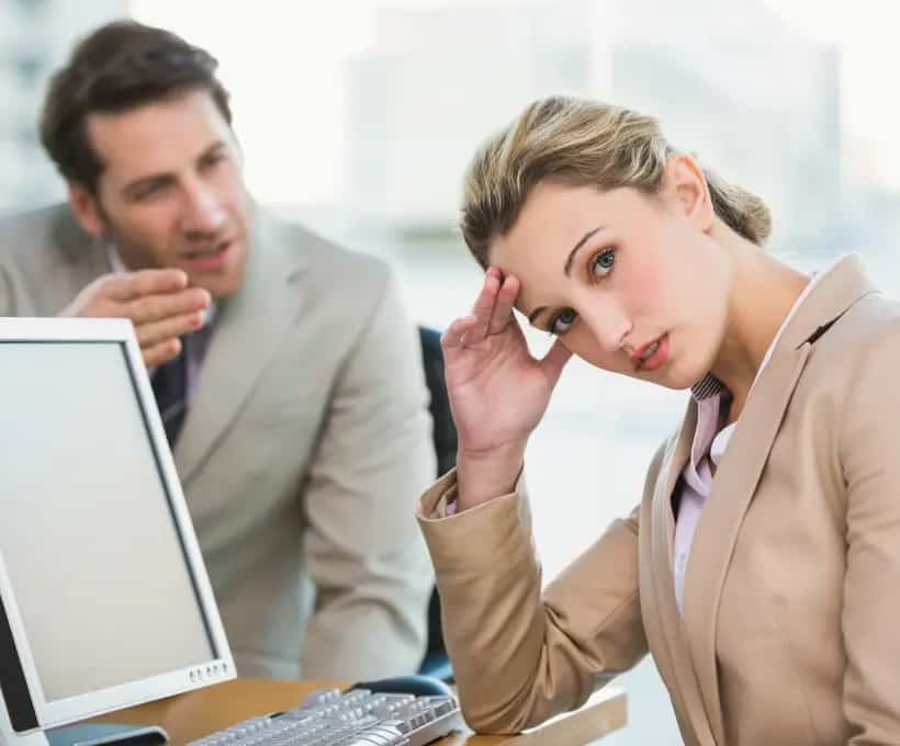 Woman Tired of Listening to Coworker Talk