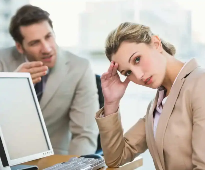 Woman Tired of Listening to Coworker Talk