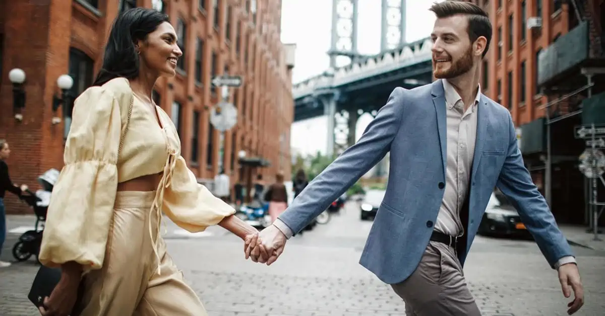 Attractive Couple Walking and Holding Hands