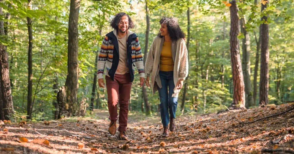 Man and Woman Walking in the Forest - Fall Dating
