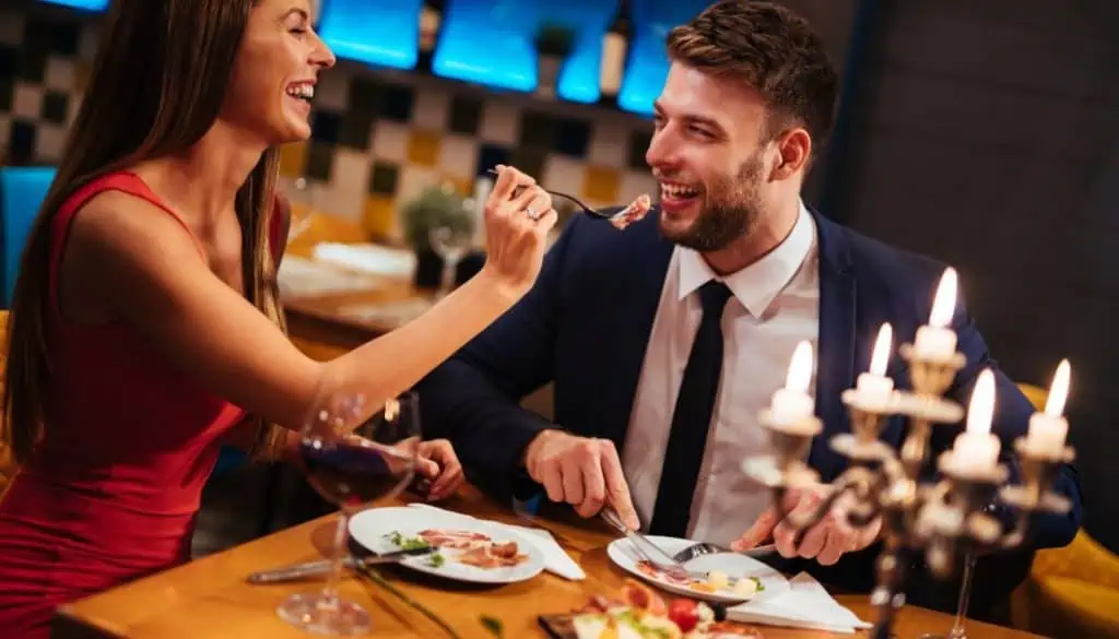 Man having dinner with older woman