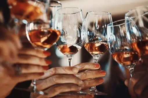 Group of people celebrating New Years with a wine tasting