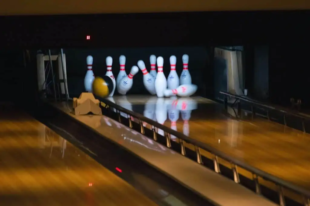 Bowling ball hitting bowling pins