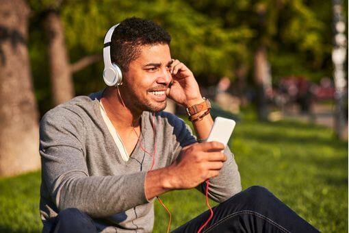 Man listening to dating podcast