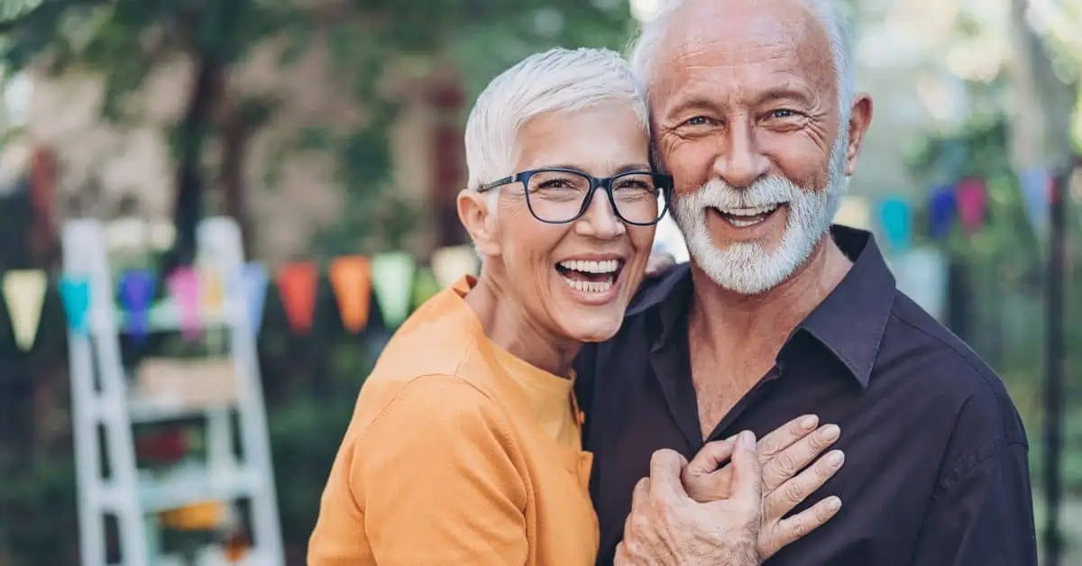 Senior couple laughing and embracing