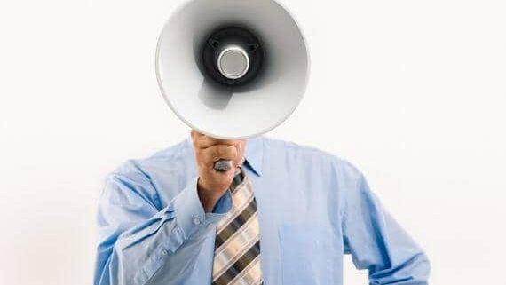 Man using megaphone to yell