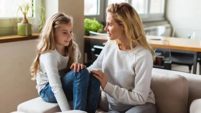 Mother talking to daughter