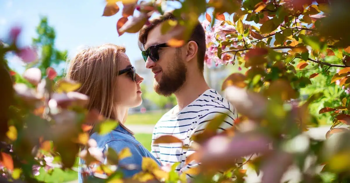 couple in sunglasses looking at each other