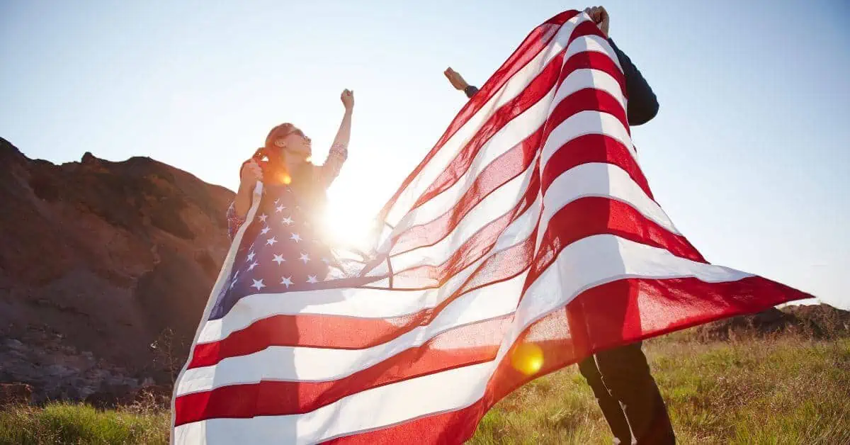 Couple holding american flag