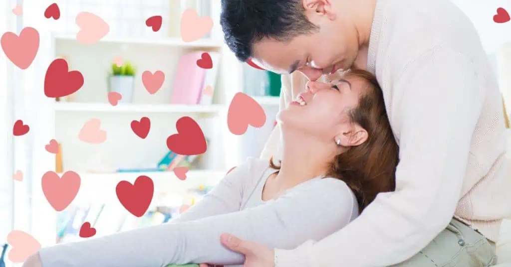 Couple embracing with heart background