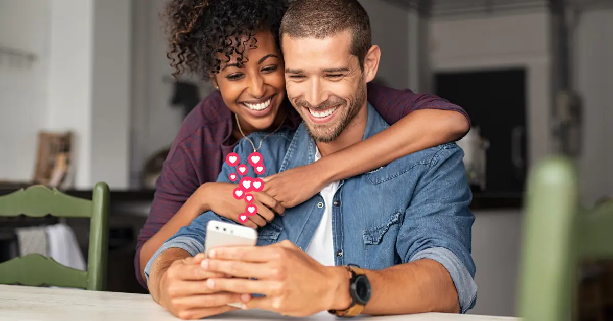 Happy Couple Looking at Phone Together - Likes Social Media