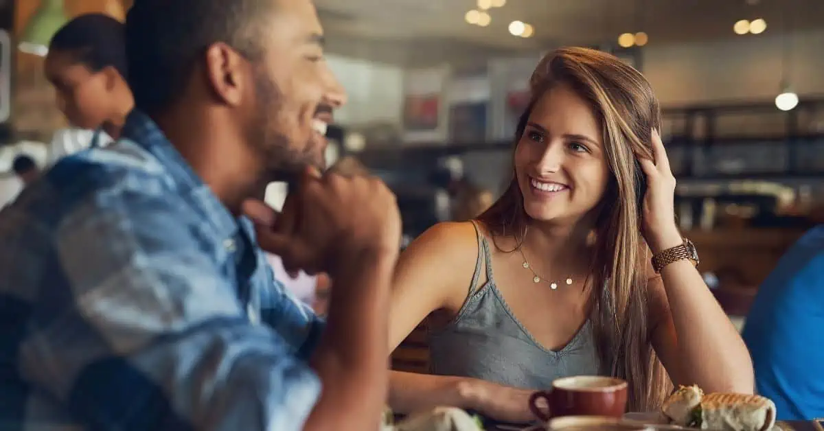 Unspoken Attraction - First Date - Man and Woman Smiling