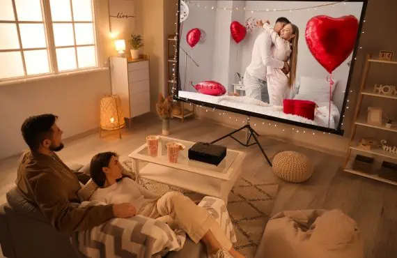 Young Couple Watching Romantic Movie at Home