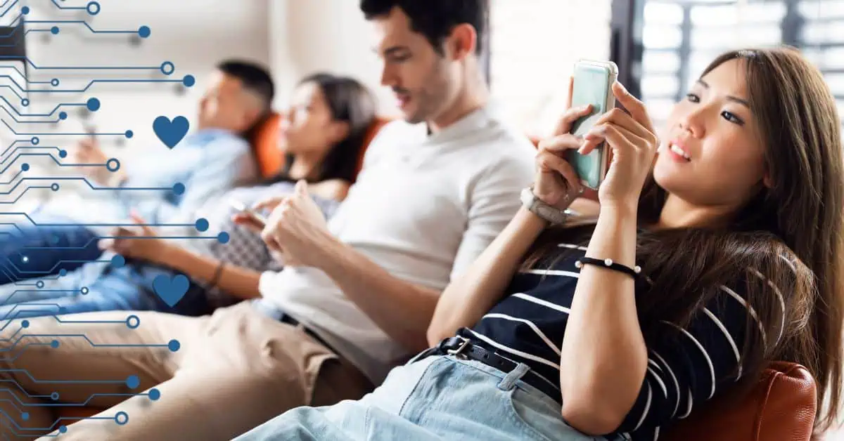 group of people looking at their phones with technology graphic with hearts