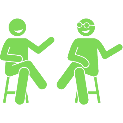 two people conversing and smiling